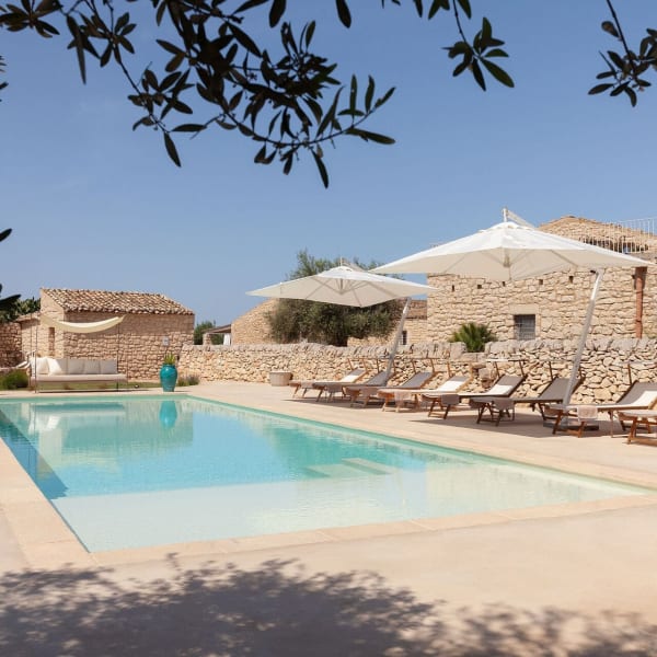 Masseria d'Estia rising above its gorgeous 15m-long pool.