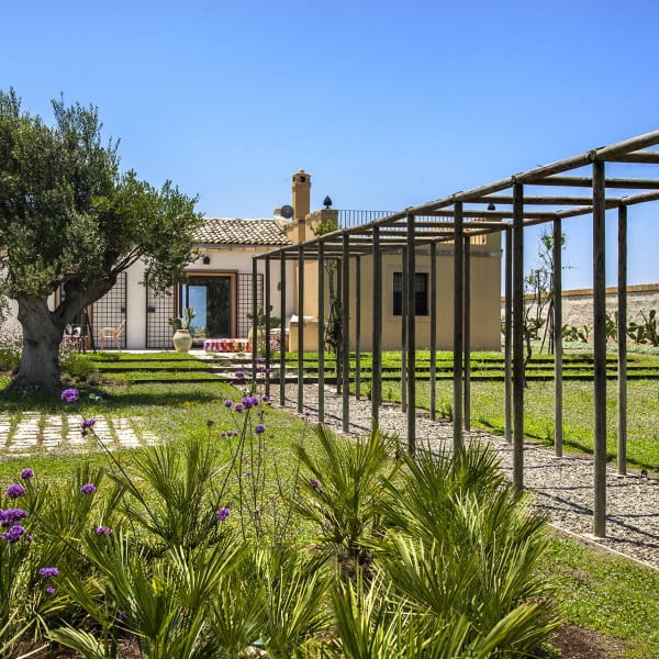 Approaching Lo Scarabeo through its long, manicured front garden.