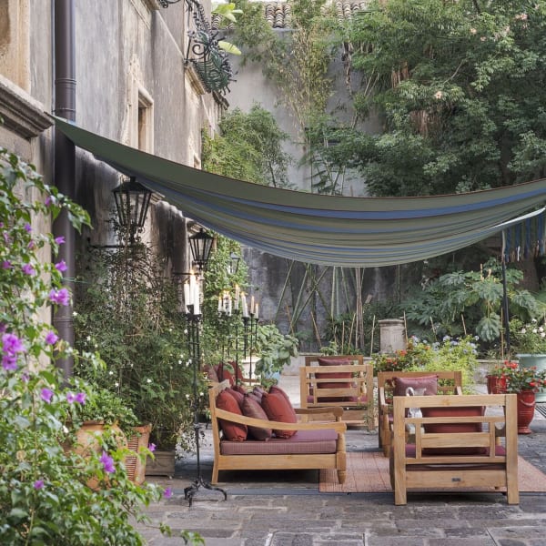 The shady sitting area outside the ground-floor bedrooms.