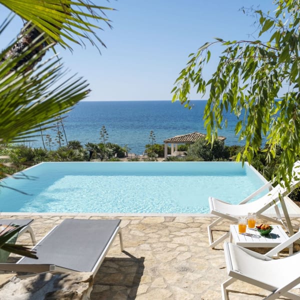 Views out across Al Profondo Blu's infinity pool to the sea.