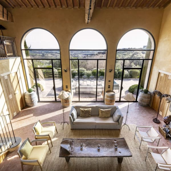 The guesthouse's voluminous "great hall" with its triptych of giant windows framing the magnificent views.