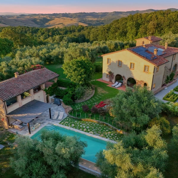 Torre Fonterinaldi with its pool and verdant grounds seen from on high.