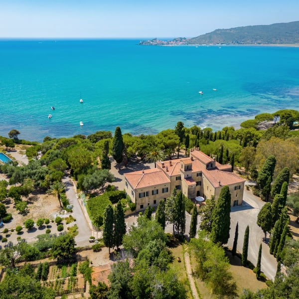 Villa Talamo, its grounds and its views over the bay to the headland of Talamone.