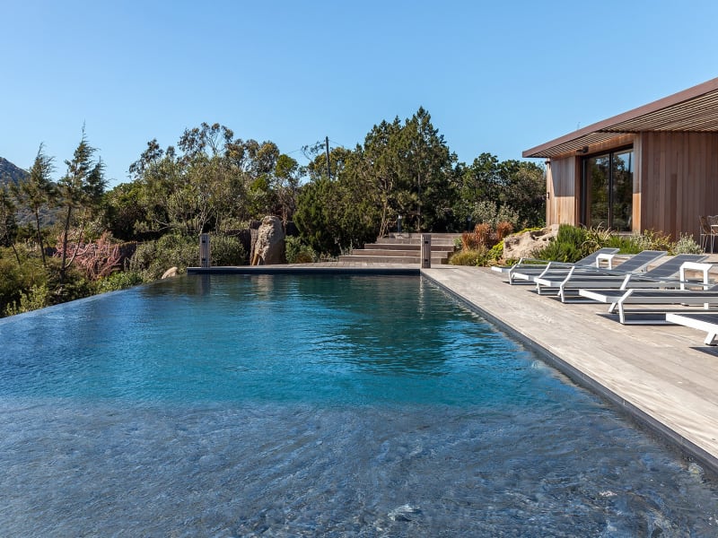 The gorgeous pool is surrounded by a large decked terrace on three sides.