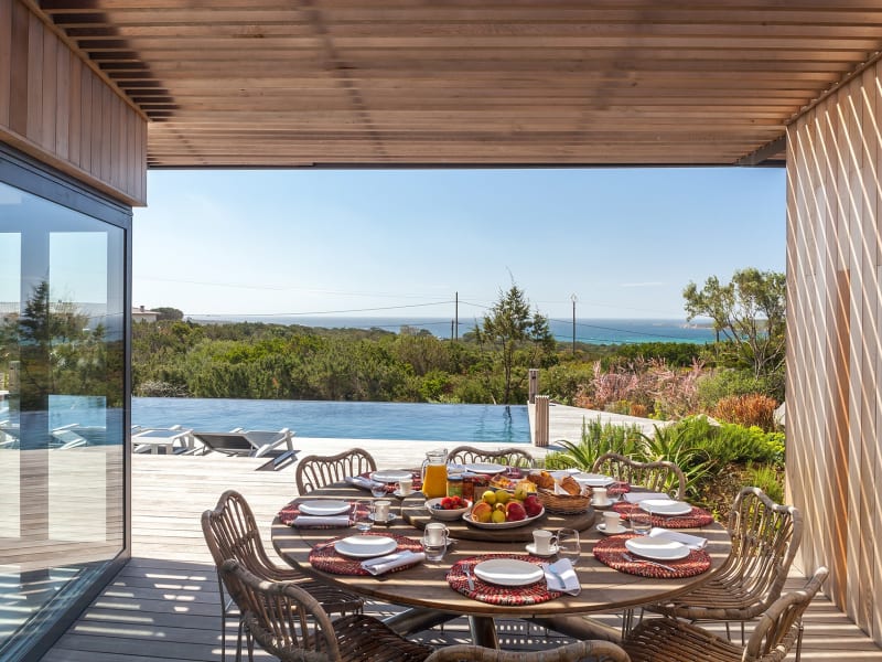 The shady outdoor dining area boasts more of those gorgeous sea views.