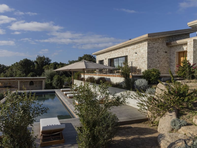 The serene pool area with the house above.