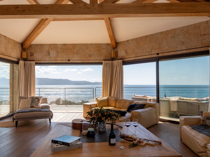 The spacious, airy living area on the upper floor with its sea views and banks of sliding doors.
