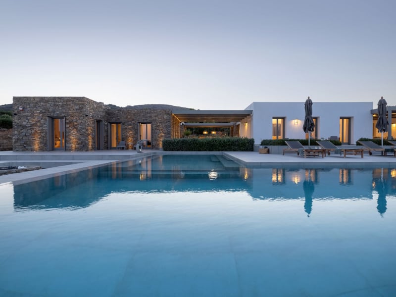 The main house (on the right) and the guesthouse (on the left) are separated by a series of well-shaded al fresco areas.