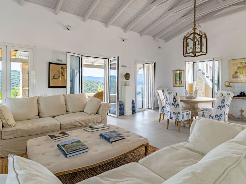 The luminous living and dining area on the upper level of the house.