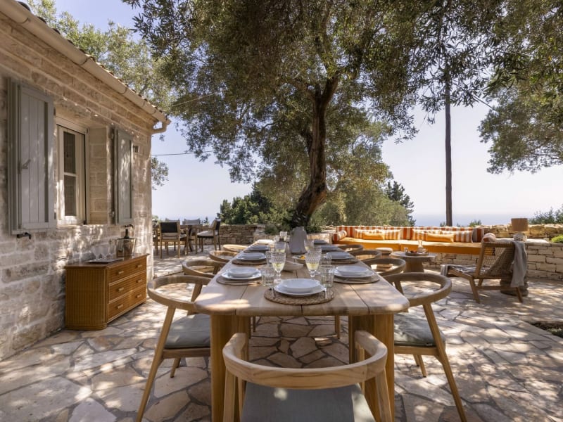 The shady al fresco dining area with the sea on the horizon.