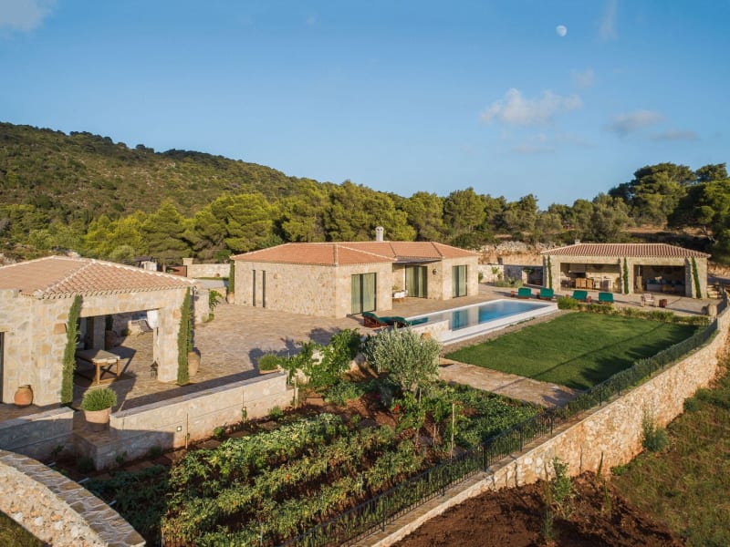 Estrella, its pool, gardens and terraces bathed in soft, late afternoon sunlight.