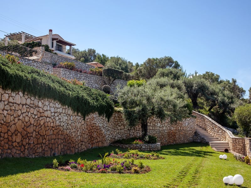 Steps lead down through the gorgeous terraced gardens.