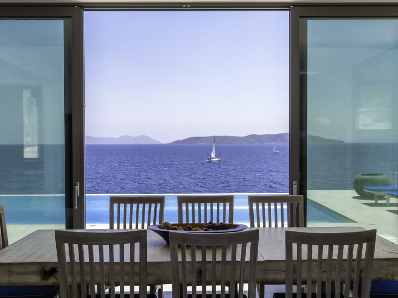The dining room has sliding glass doors and stunning views.
