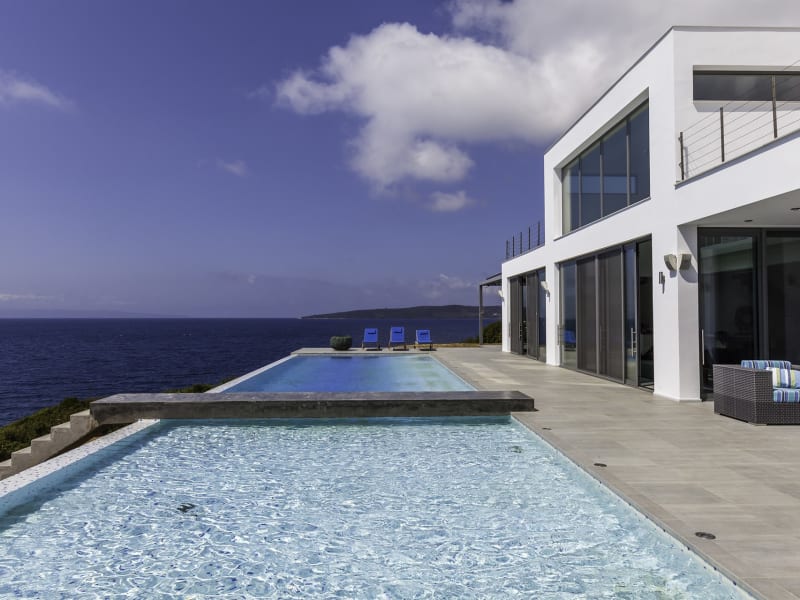 The contemporary design of Penio with its walls of glass sliding doors.