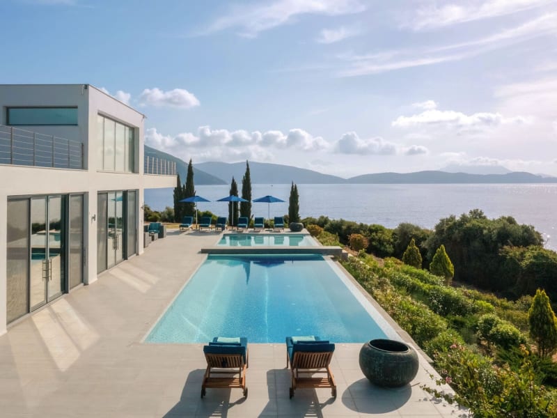 The sleek infinity pool complements the contemporary architecture of the house.