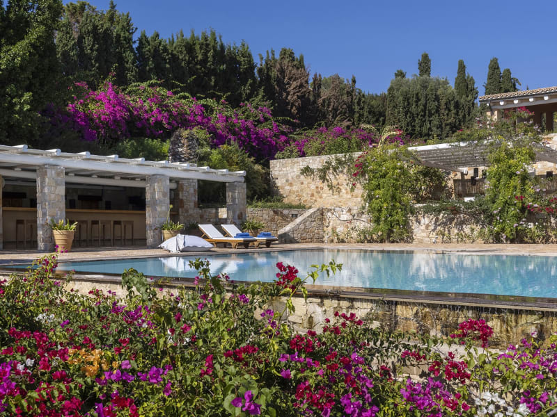 Vibrantly colourful flowers and emerald greenery cocoon the property in an atmosphere of fragrant tranquillity.