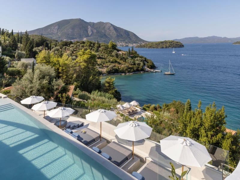 The pool and the lower terrace with views out over the sea and Lefkada's verdant coastline.