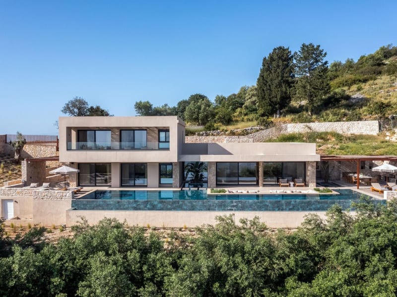 Villa Galinia's handsome contemporary façade rising above its superb, 23m-long infinity pool.