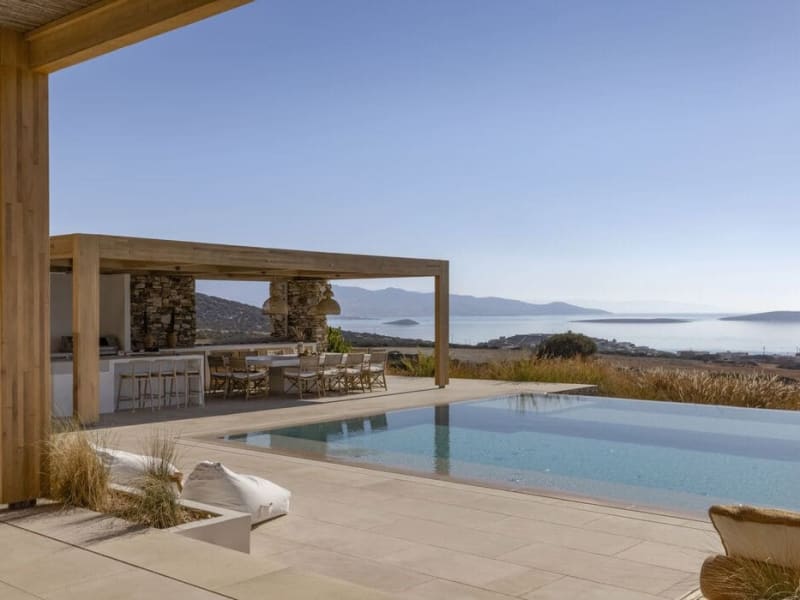Xasteria's serene, 15m-long infinity pool and its al fresco bar and dining area.