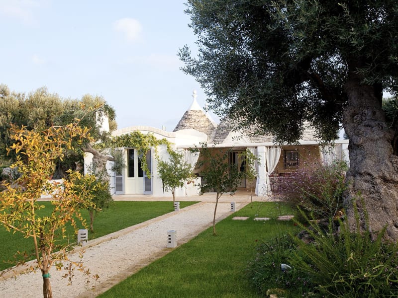 Approaching the trulli part of the property through the gardens.