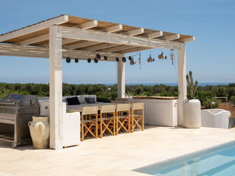 The shaded al fresco dining area by the pool.