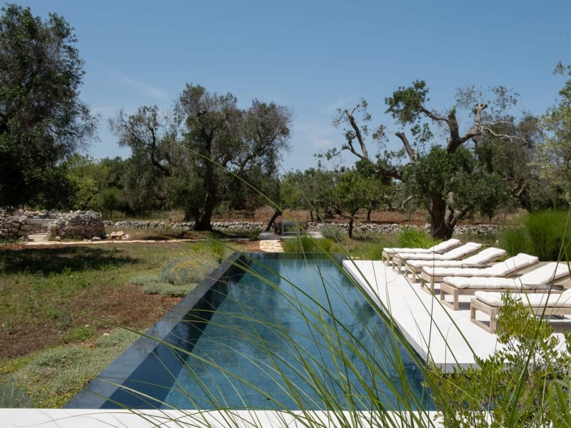 Choose your spot by the cobalt waters of the pool.