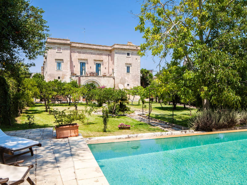 The handsome facade of Palazzo Colucci seen from the pool.
