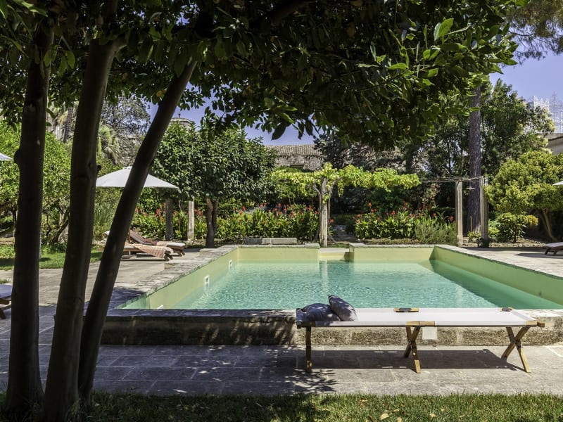 The pool has been built in place of the original irrigation tank in the garden.