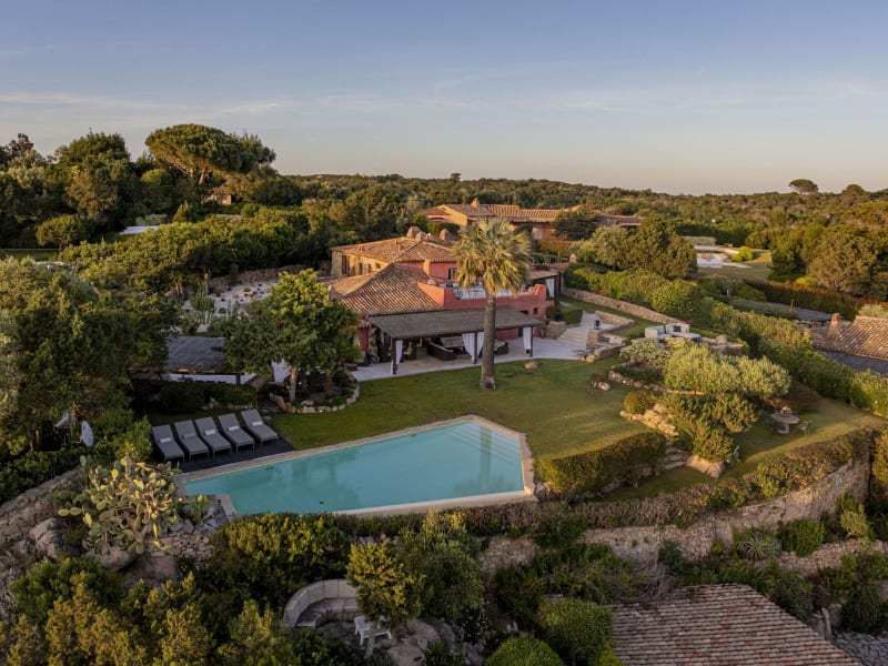 I Corbezzoli rising amidst its flourishing, luxuriant gardens.