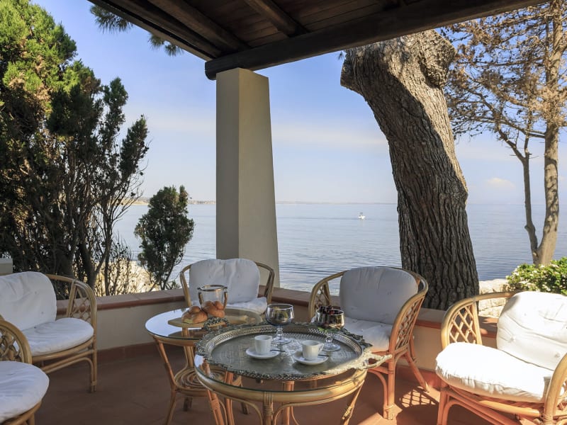 The shaded al fresco living area to one side of the house.