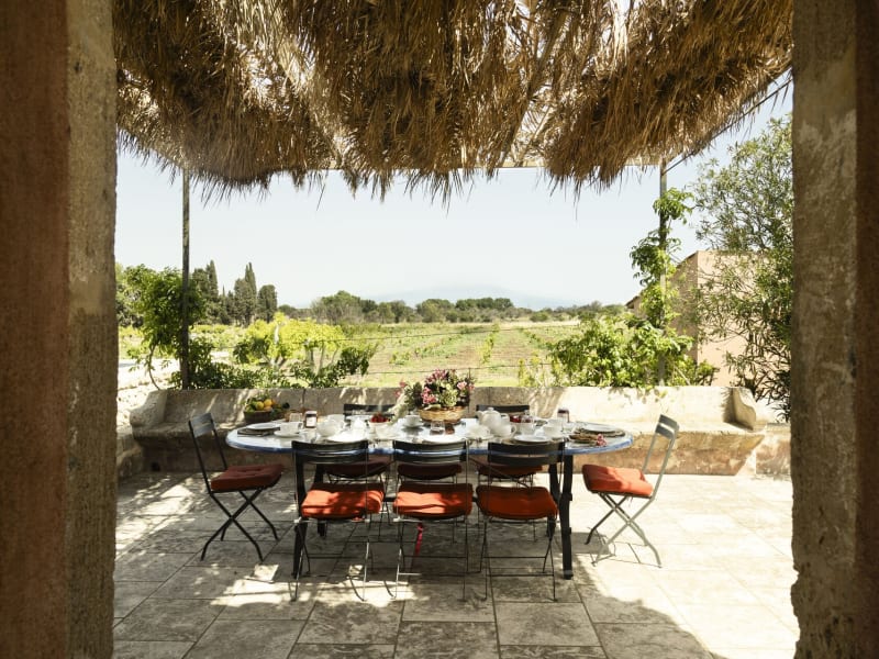 Arbolì's shady al fresco dining area seen from the kitchen.