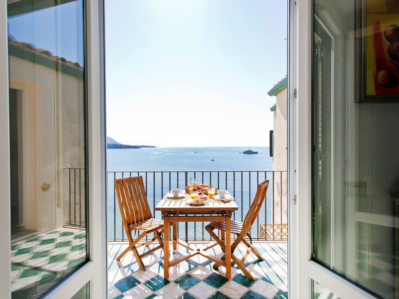 Looking out from the kitchen diner to the sea-front terrace.