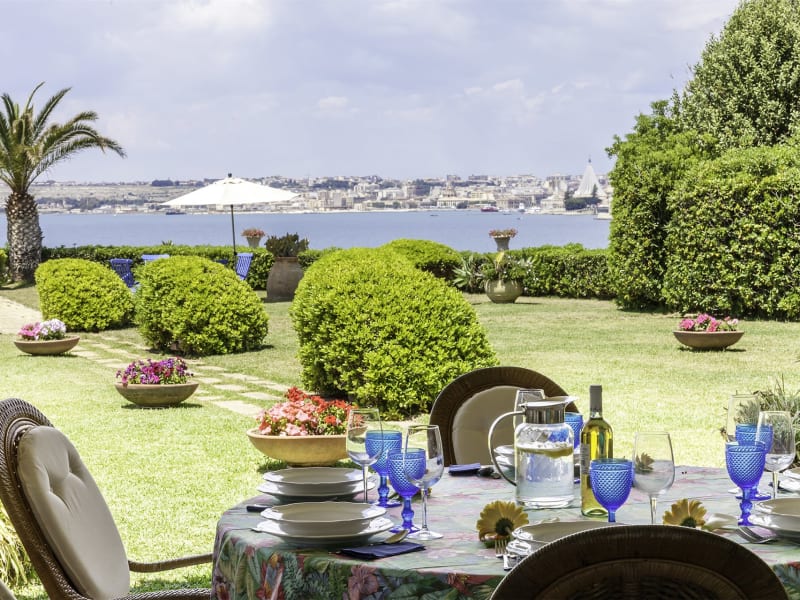 Dining on the shady terrace outside the living area.