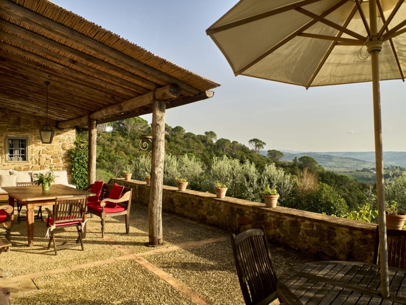 The living area opens out onto this fabulous, panoramic terrace that's furnished for lounging and dining.