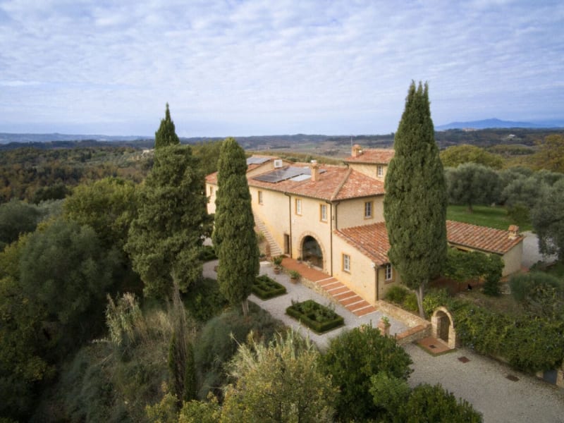 Torre Fonterinaldi rising handsomely between its cypress trees.