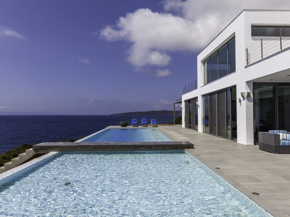 The contemporary design of Penio with its walls of glass sliding doors.