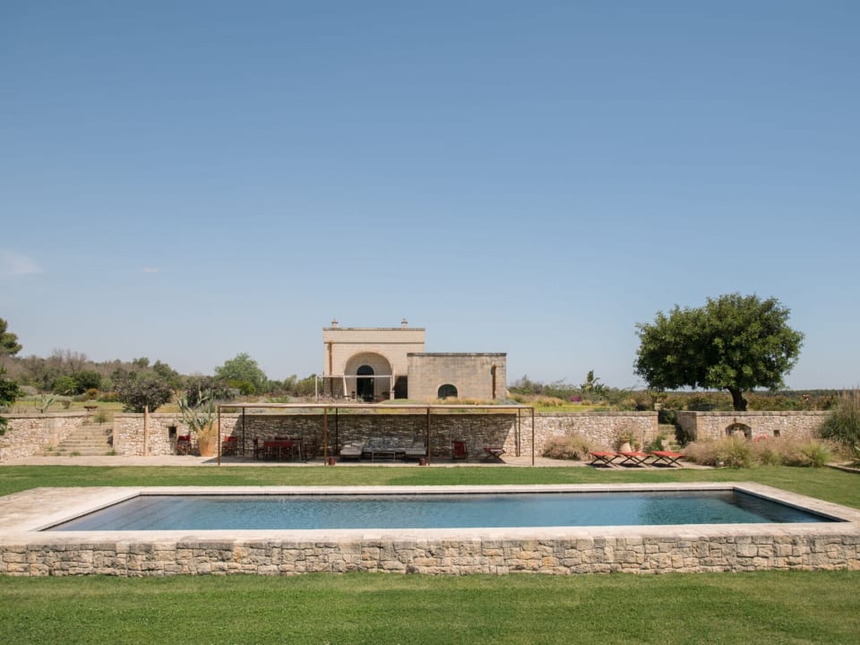 The pool with the house rising above.