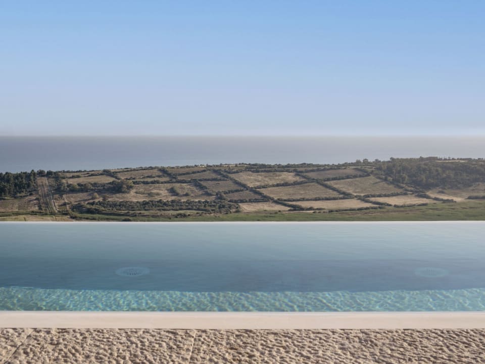 The glorious pool and the views out across Torre Salsa Nature Reserve to the sea.
