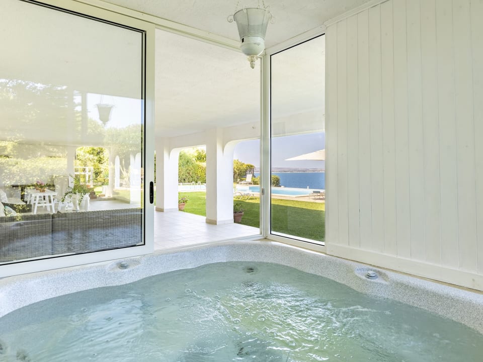 The Jacuzzi has views of the garden and the sea.