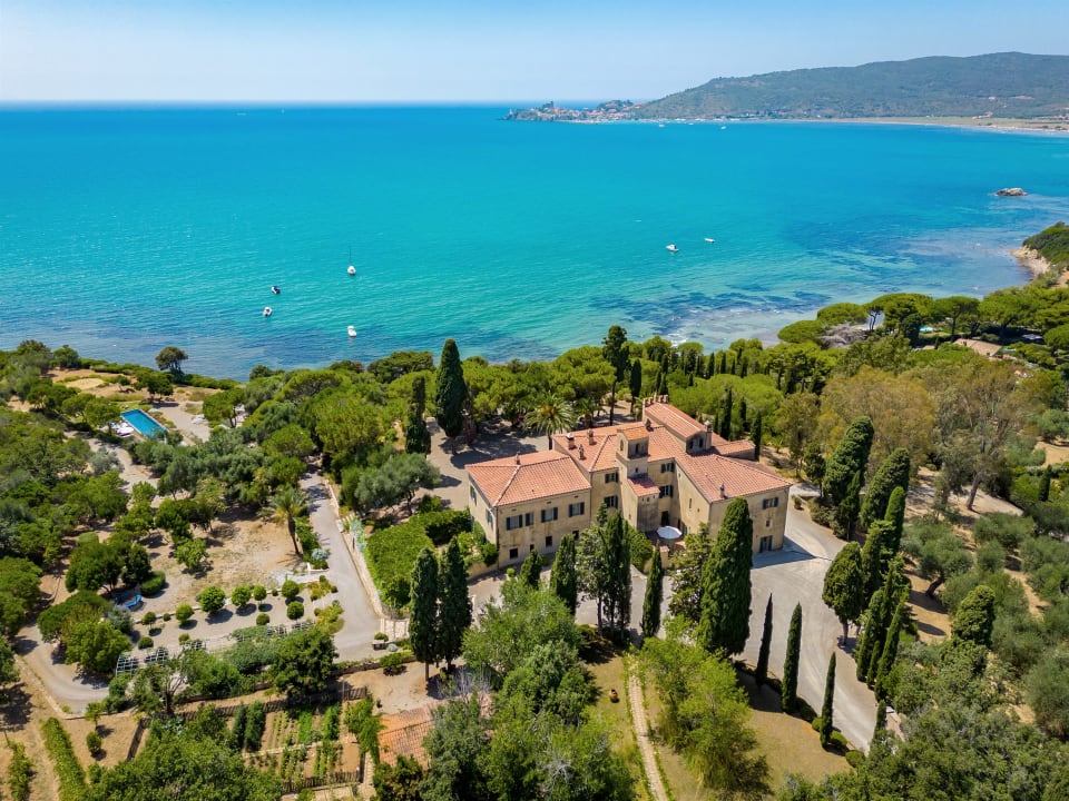 Villa Talamo, its grounds and its views over the bay to the headland of Talamone.