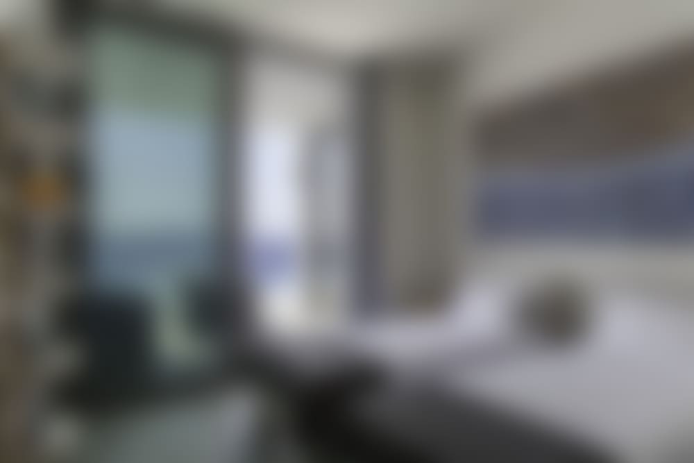 The second double-twin bedroom with its sea and pool views (bedroom 2). 