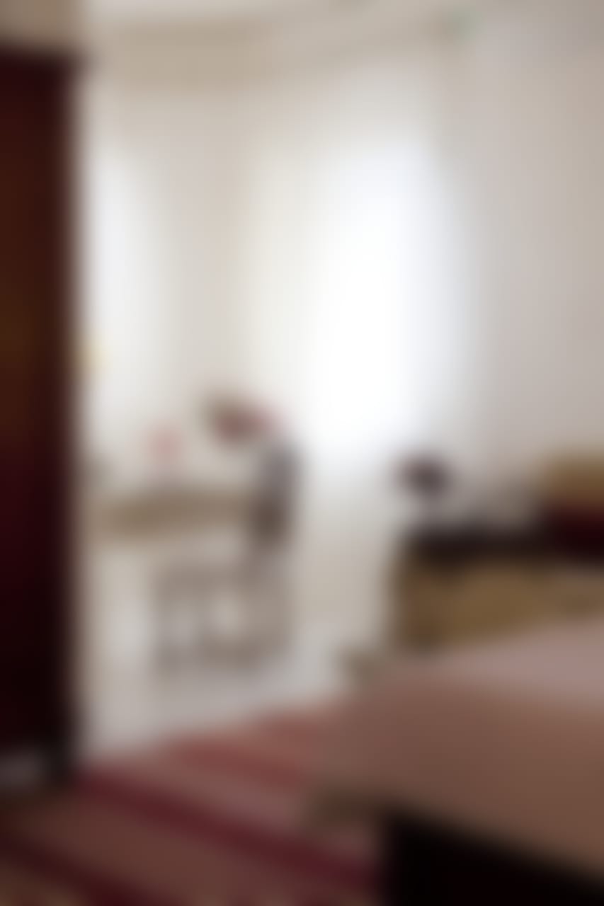 One of the double-twin bedrooms (bedroom 1). The windows look out to sea.