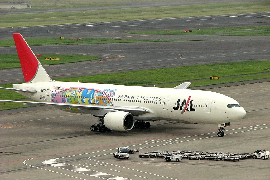 A Japan Airlines Boeing 777 painted with a Tamagotchi theme in 2006. Photo by Yamaguchi Yoshiaki. A Japan Airlines Boeing 777 painted with a Tamagotchi theme in 2006. Photo by Yamaguchi Yoshiaki.