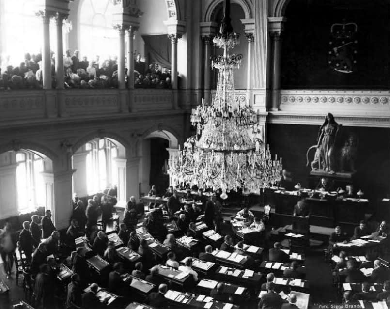 Historic parliamentary session depicting formal debate and decision-making in a democratic institution. The Eduskunta, the parliament of the Grand Duchy of Finland (then part of Russia), had universal suffrage in 1906. Several states and territories can present arguments for being the first with universal suffrage. Historic parliamentary session depicting formal debate and decision-making in a democratic institution. The Eduskunta, the parliament of the Grand Duchy of Finland (then part of Russia), had universal suffrage in 1906. Several states and territories can present arguments for being the first with universal suffrage.