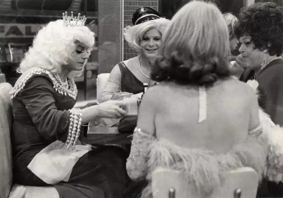Gender non-conforming individuals gathered in a social setting during the mid-20th century, representing figures often at the forefront of early LGBTQ+ activism. Photo by the Gay, Lesbian, Bisexual, Transgender Historical Society. Gender non-conforming individuals gathered in a social setting during the mid-20th century, representing figures often at the forefront of early LGBTQ+ activism. Photo by the Gay, Lesbian, Bisexual, Transgender Historical Society.