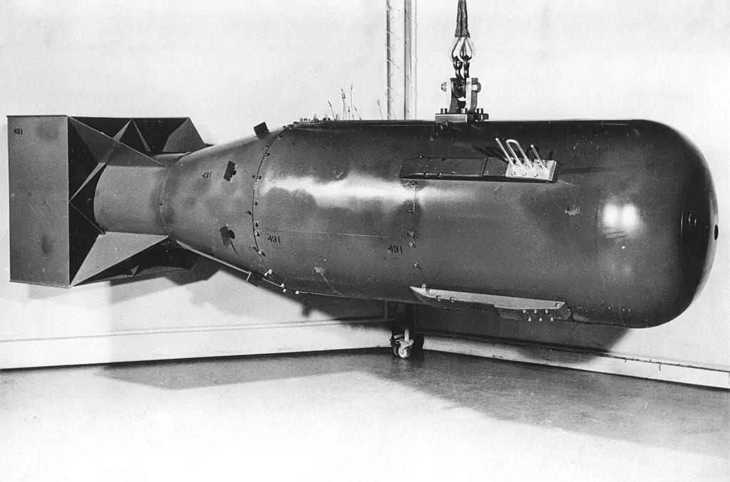 Photograph of a Little Boy atomic bomb, the same type of weapon dropped on Hiroshima, Japan, in August 1945. This was the first photograph of a Little Boy bomb casing to ever be released by the U.S. government (it was declassified in 1960). This photograph is of a postwar Little Boy unit, and is not the exact bomb dropped over Japan. Public domain. Photograph of a Little Boy atomic bomb, the same type of weapon dropped on Hiroshima, Japan, in August 1945. This was the first photograph of a Little Boy bomb casing to ever be released by the U.S. government (it was declassified in 1960). This photograph is of a postwar Little Boy unit, and is not the exact bomb dropped over Japan. Public domain.