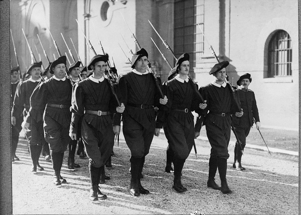 Marching in exercise uniform with Gewehr 98 rifles, 1938. Public domain. Marching in exercise uniform with Gewehr 98 rifles, 1938. Public domain.