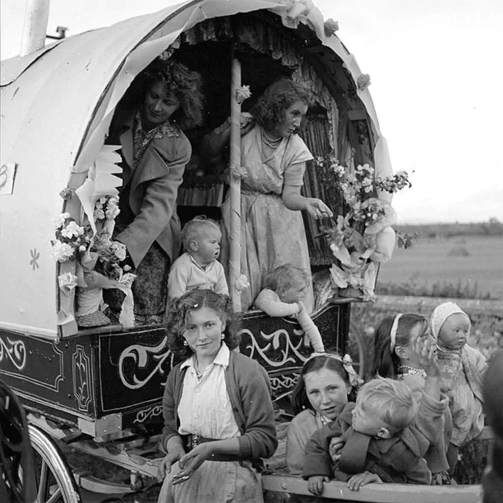 Irish traveller family in their decorated caravan en route to the Cahirmee Horse Fair at Buttevant, Co. Cork. Photo by National Library of Ireland on The Commons. Irish traveller family in their decorated caravan en route to the Cahirmee Horse Fair at Buttevant, Co. Cork. Photo by National Library of Ireland on The Commons.