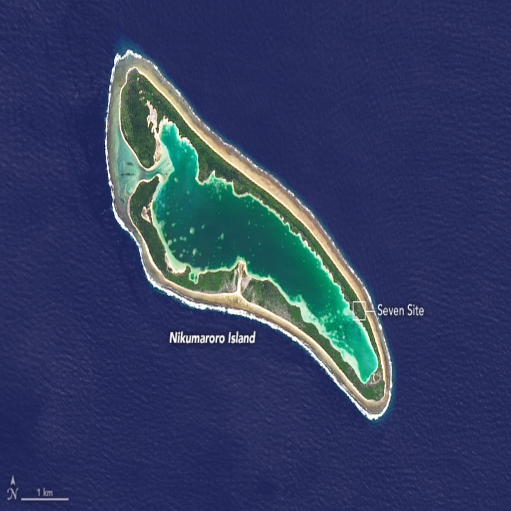 Gardner (Nikumaroro) Island in 2014. "Seven Site" is a focus of the search for Earhart's remains. Photo by NASA Earth Observatory image by Joshua Stevens, using Landsat data from the U.S. Geological Survey. Gardner (Nikumaroro) Island in 2014. "Seven Site" is a focus of the search for Earhart's remains. Photo by NASA Earth Observatory image by Joshua Stevens, using Landsat data from the U.S. Geological Survey.