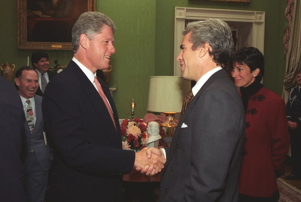 Epstein shaking hands with President Bill Clinton at the White House, September 1993 (with Ghislaine Maxwell in the background on the right). Photo by White House photographer Ralph Alswang, Public domain. Epstein shaking hands with President Bill Clinton at the White House, September 1993 (with Ghislaine Maxwell in the background on the right). Photo by White House photographer Ralph Alswang, Public domain.